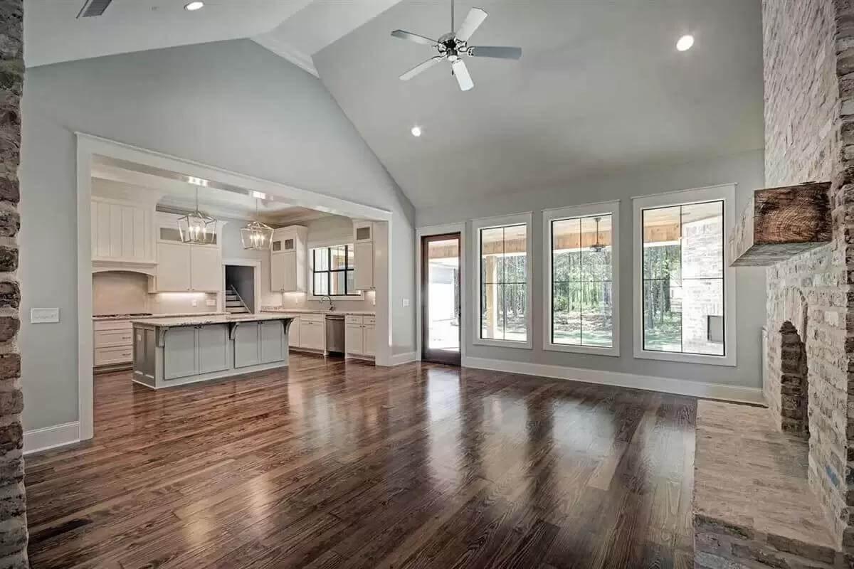 Vaulted Ceilings and Open Spaces Meet Brick Fireplace Charm
