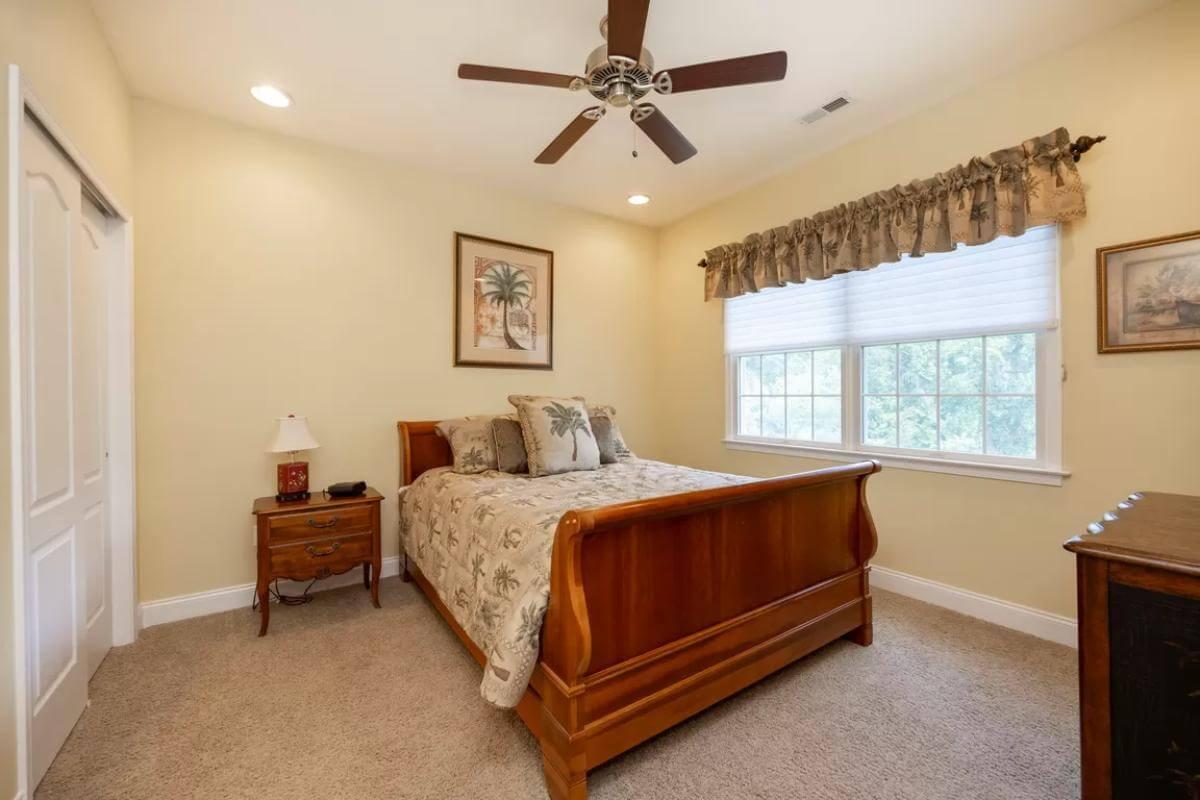 Cozy Bedroom with Sleigh Bed and Wood Accents