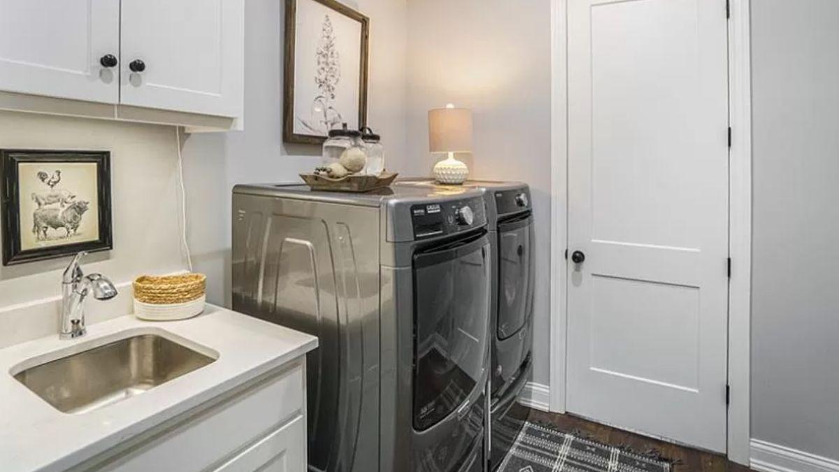 Chic Laundry Room with Modern Touches and Practical Sink