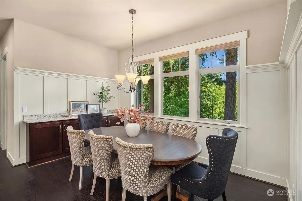 Charming Dining Area with a Granite Buffet and Forest Views