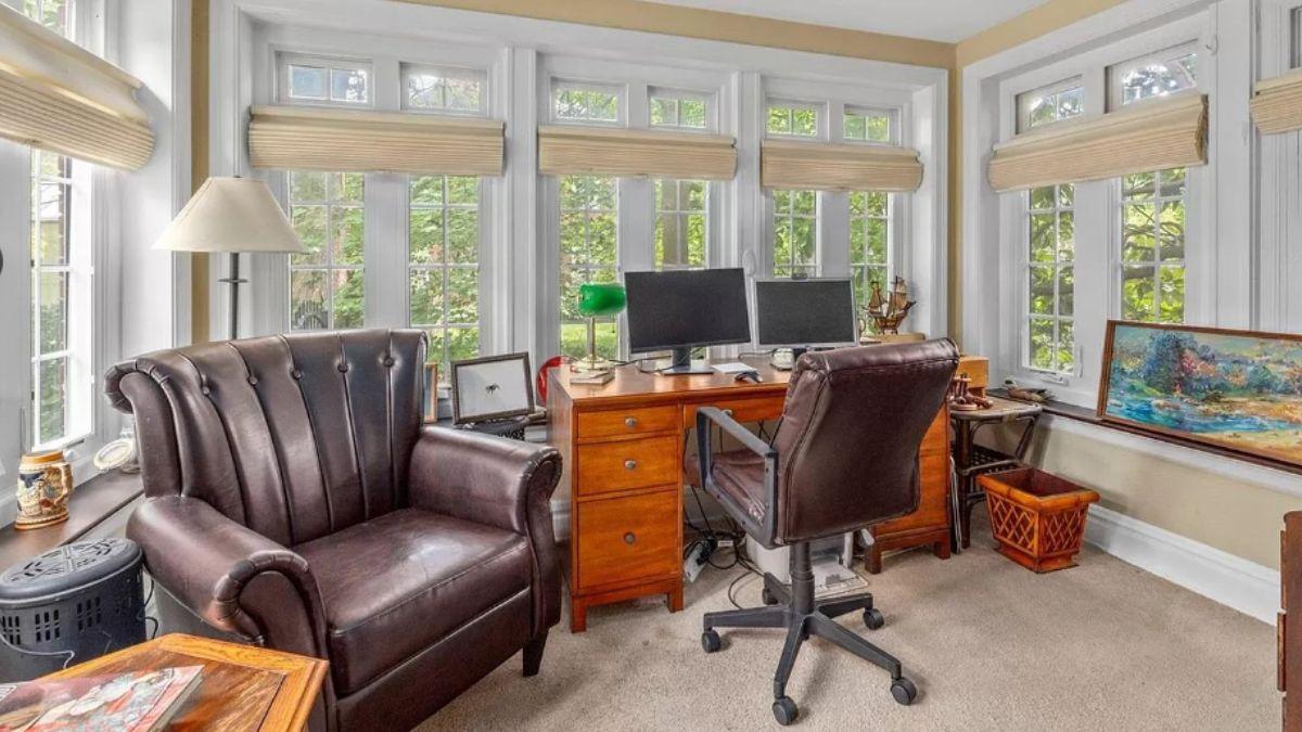 Bright Home Office with Expansive Windows and Leather Accents