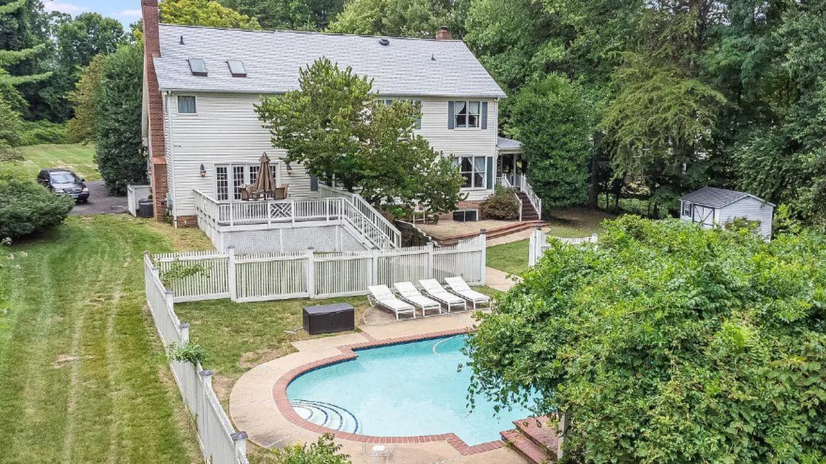 Explore This Classic Family Home with a Deck Overlooking the Pool