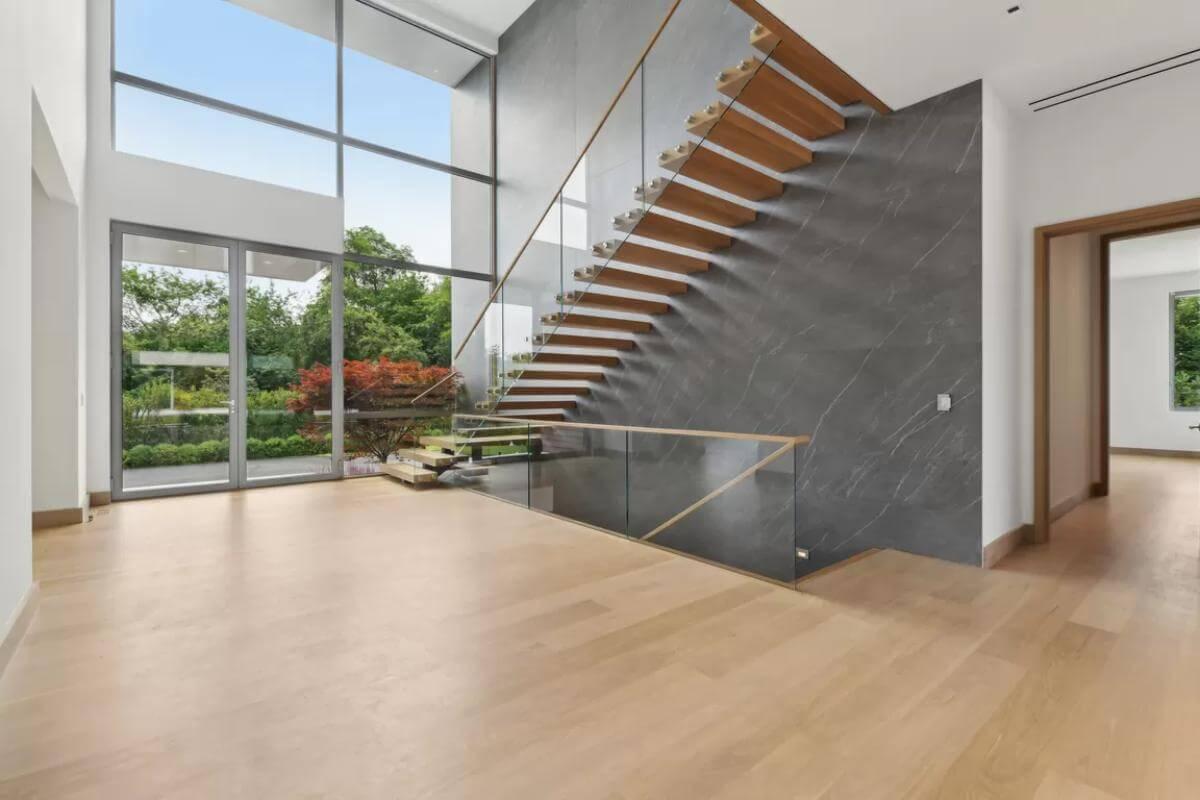 Wow, Look at This Floating Staircase and Soaring Windows