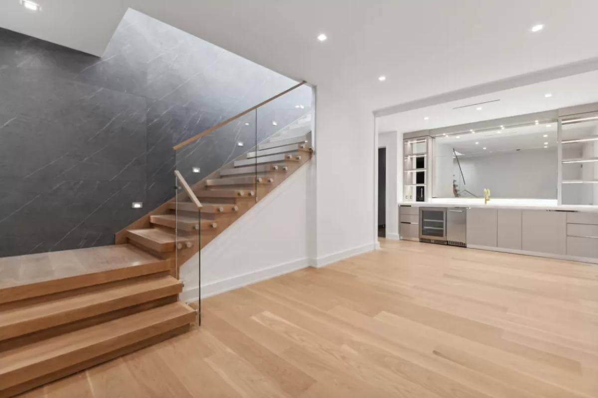 Wow, Check Out the Sleek Staircase with Glass Railing