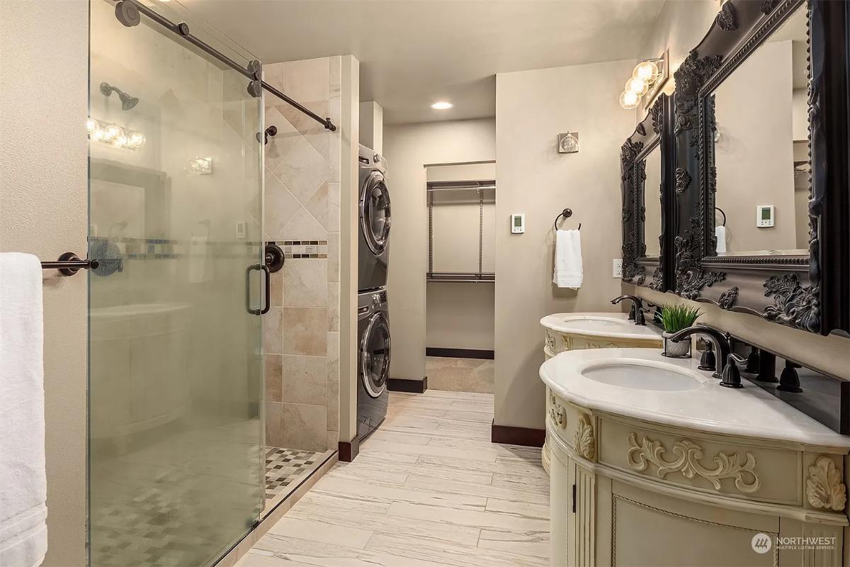 Elegant Bathroom With Ornate Vanity and Integrated Laundry Space
