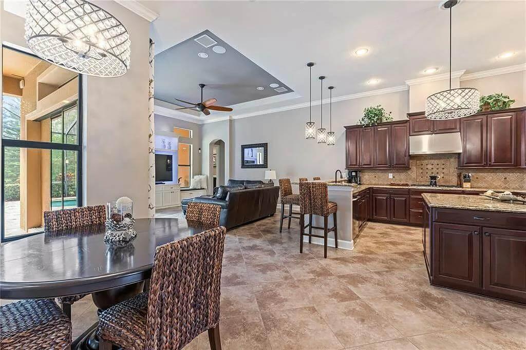 Check Out the Striking Pendant Lighting in This Spacious Kitchen