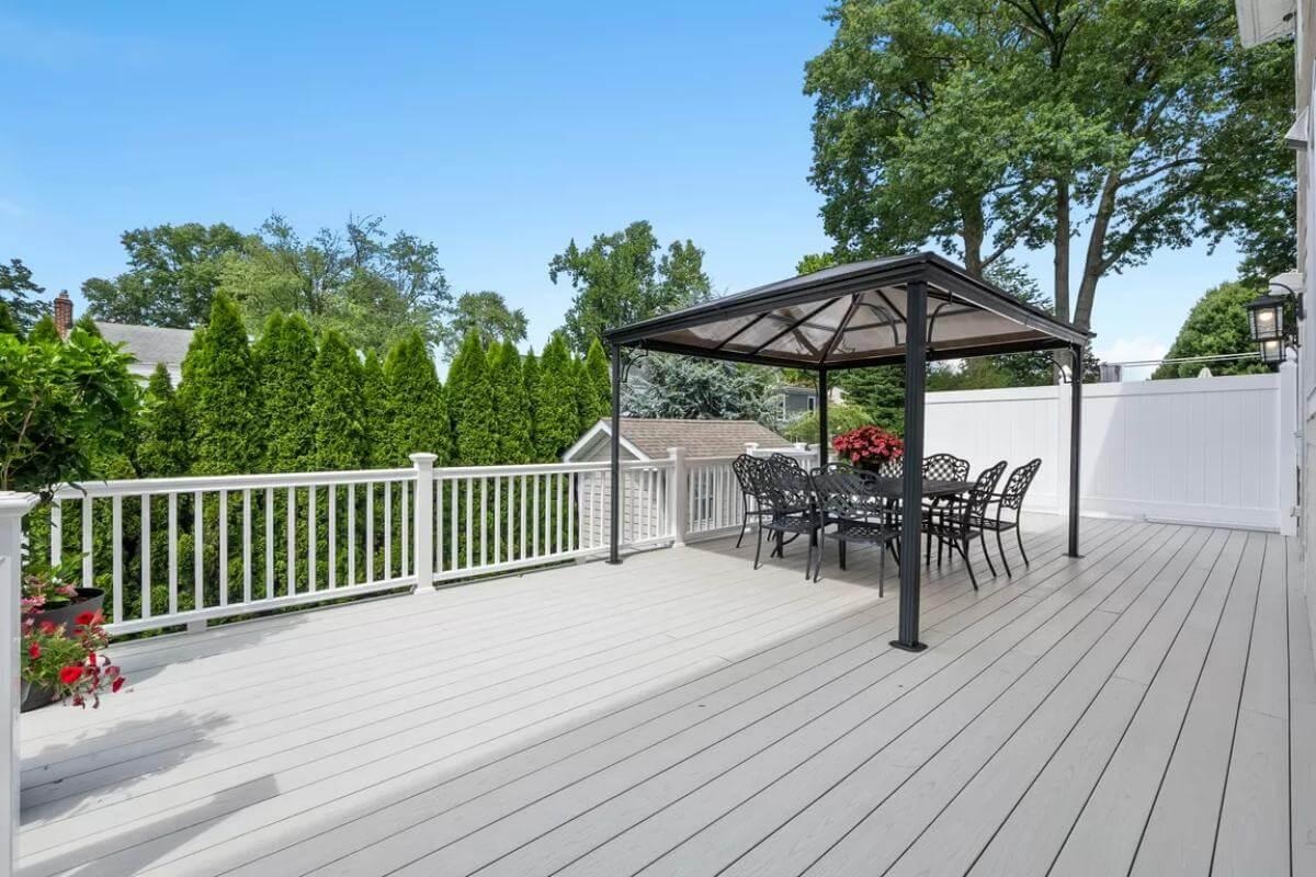 Step Onto This Expansive Deck with a Charming Pergola