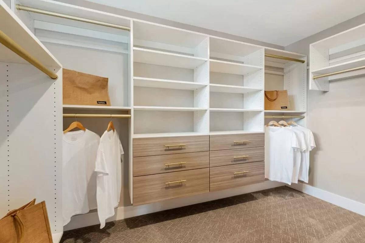 Spacious Walk-In Closet with Stylish Brass Accents