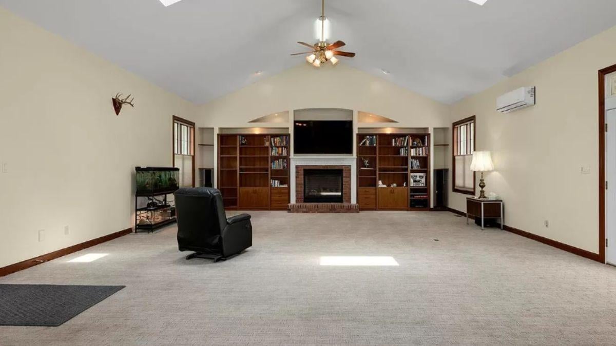 Spacious Living Room with Built-In Shelving Around the Fireplace