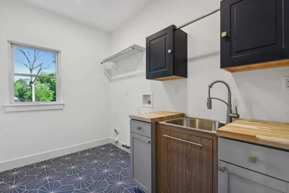 Efficient and Stylish Laundry Room with Geometric Tile Flooring