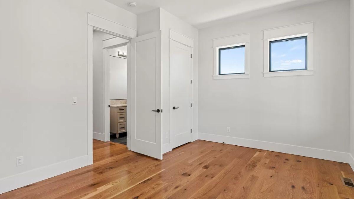 Notice the Clean Lines and Warm Wood Floors in This Simple Bedroom