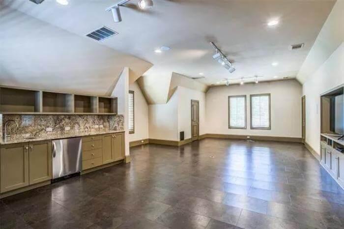 Sleek Multi-Purpose Room with Built-In Storage and Granite Countertops