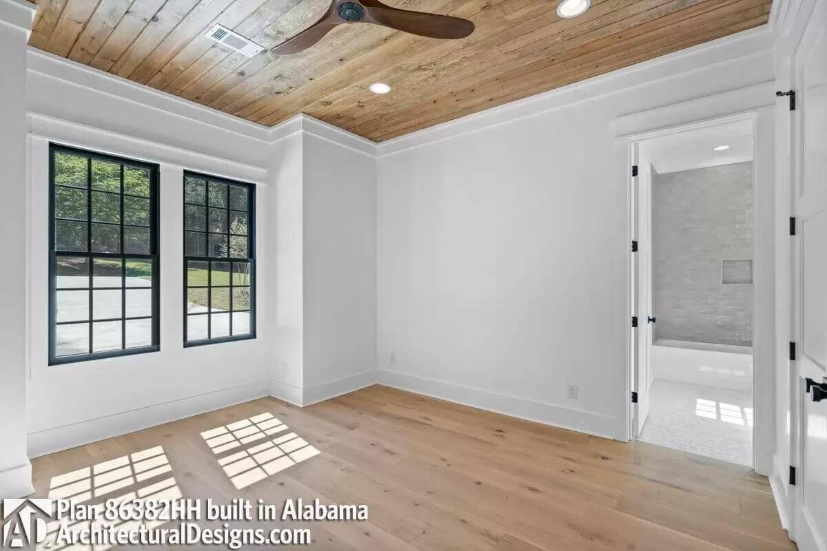 Admire the Natural Light in This Room with a Warm Wooden Ceiling