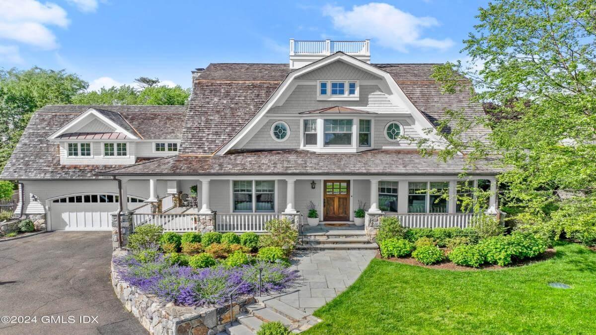 Classic Craftsman Facade with a Grand Porch and Charming Bay Windows