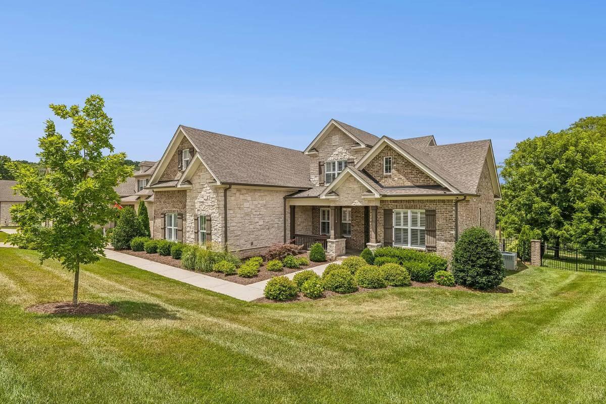 Appreciate the Blend of Stone and Brick on This Elegant Facade
