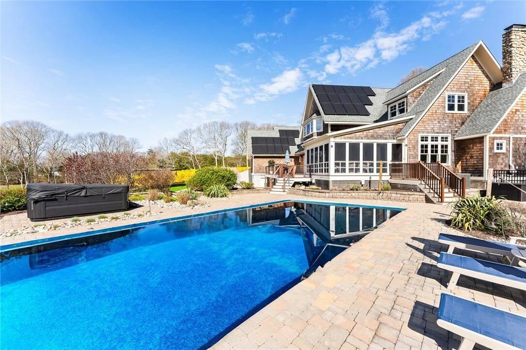 Explore the Outdoor Oasis with Solar Panels and a Sparkling Pool