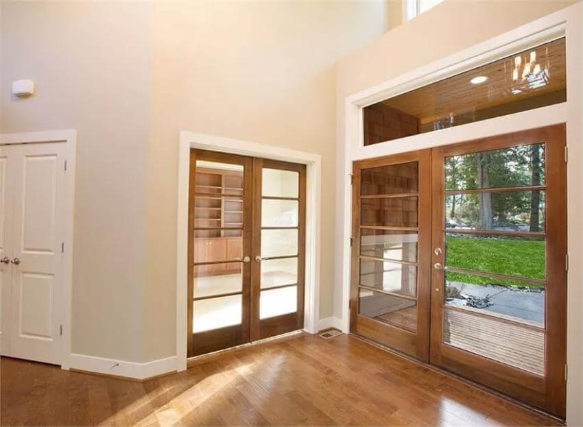Admire the Double French Doors in This Bright Entryway