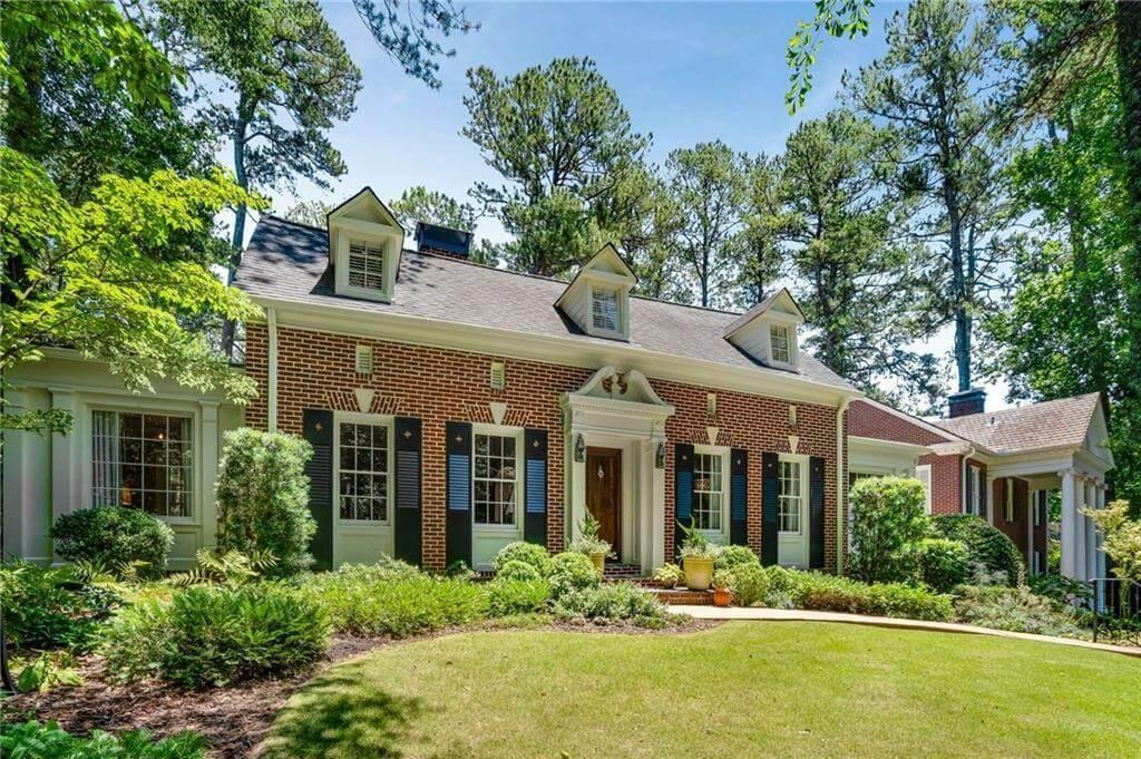Charming Brick Facade with Colonial Details and Dormer Windows