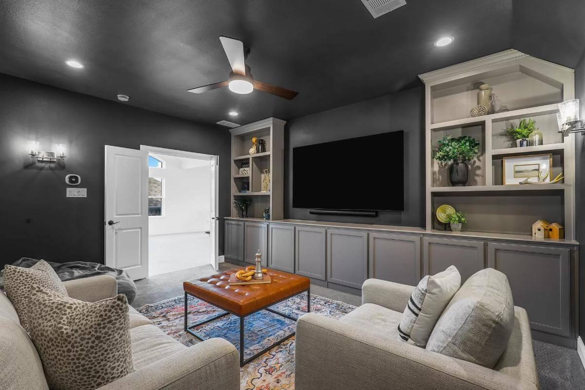 Explore This Cozy Media Room with Built-In Shelving