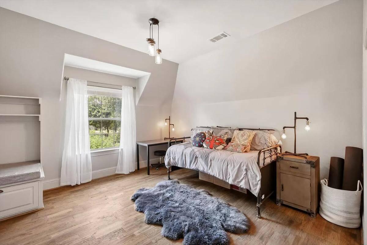Charming Bedroom Corner with Industrial Lighting and Cozy Accents