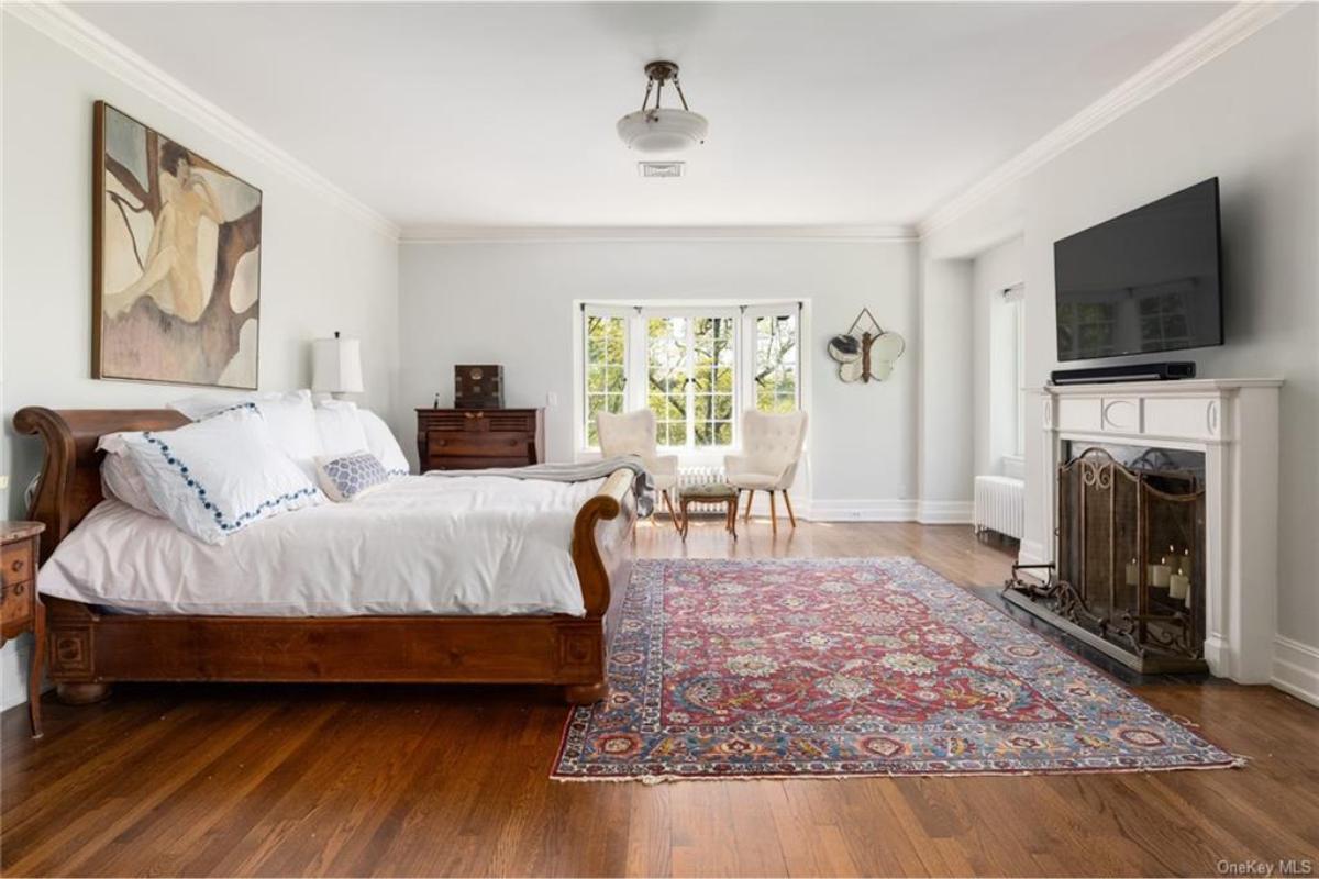Check Out the Fireplace in This Spacious, Light-Filled Bedroom