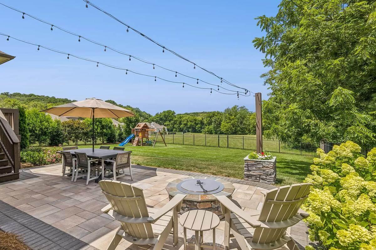 Explore This Inviting Patio with Fire Pit and Scenic Views