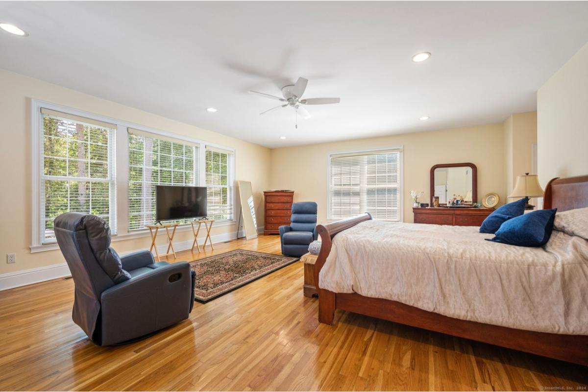 Relax in This Sun-Drenched Bedroom with Elegant Wooden Accents