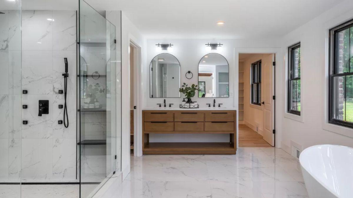 Check Out the Dual Vanity and Elegant Marble Accents in This Contemporary Bathroom