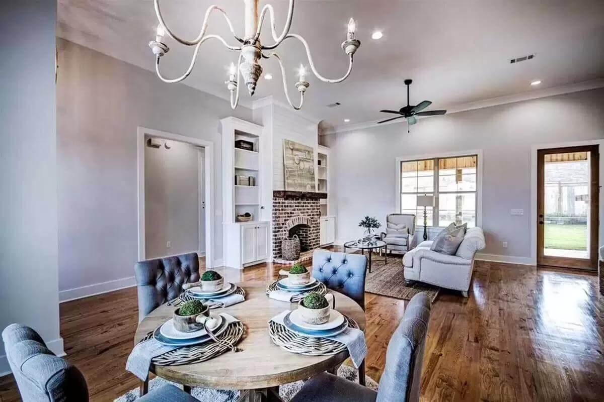 Subtle Elegance: A Living Space with Brick Fireplace and Styled Dining