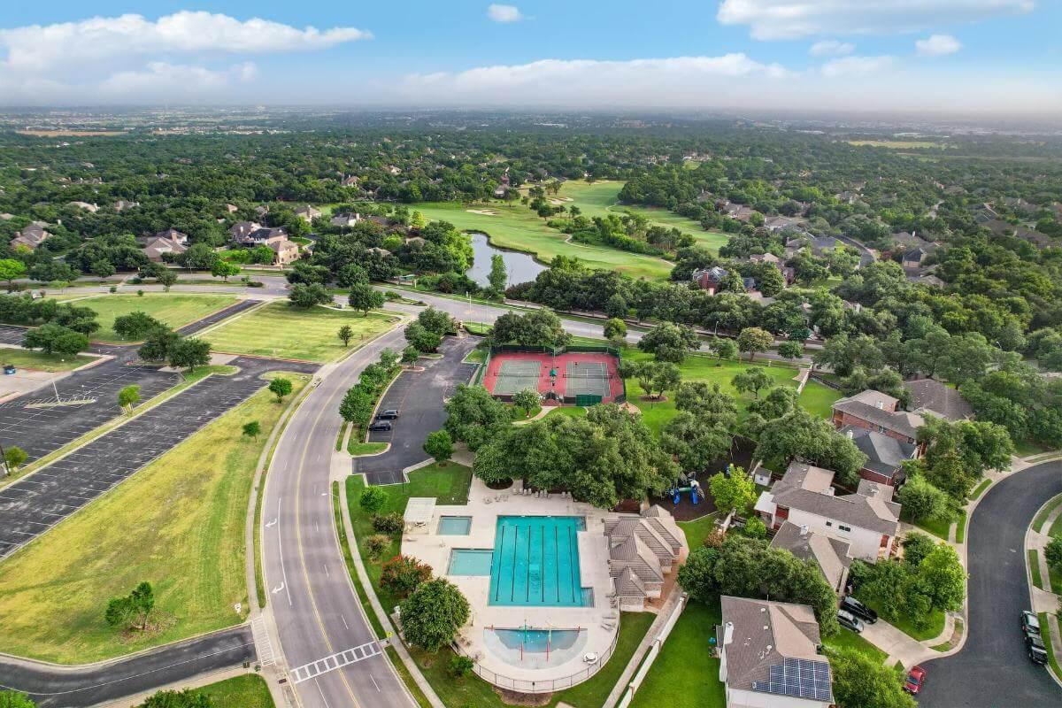Explore This Inviting Community with a Pool, Tennis Courts, and Scenic Views