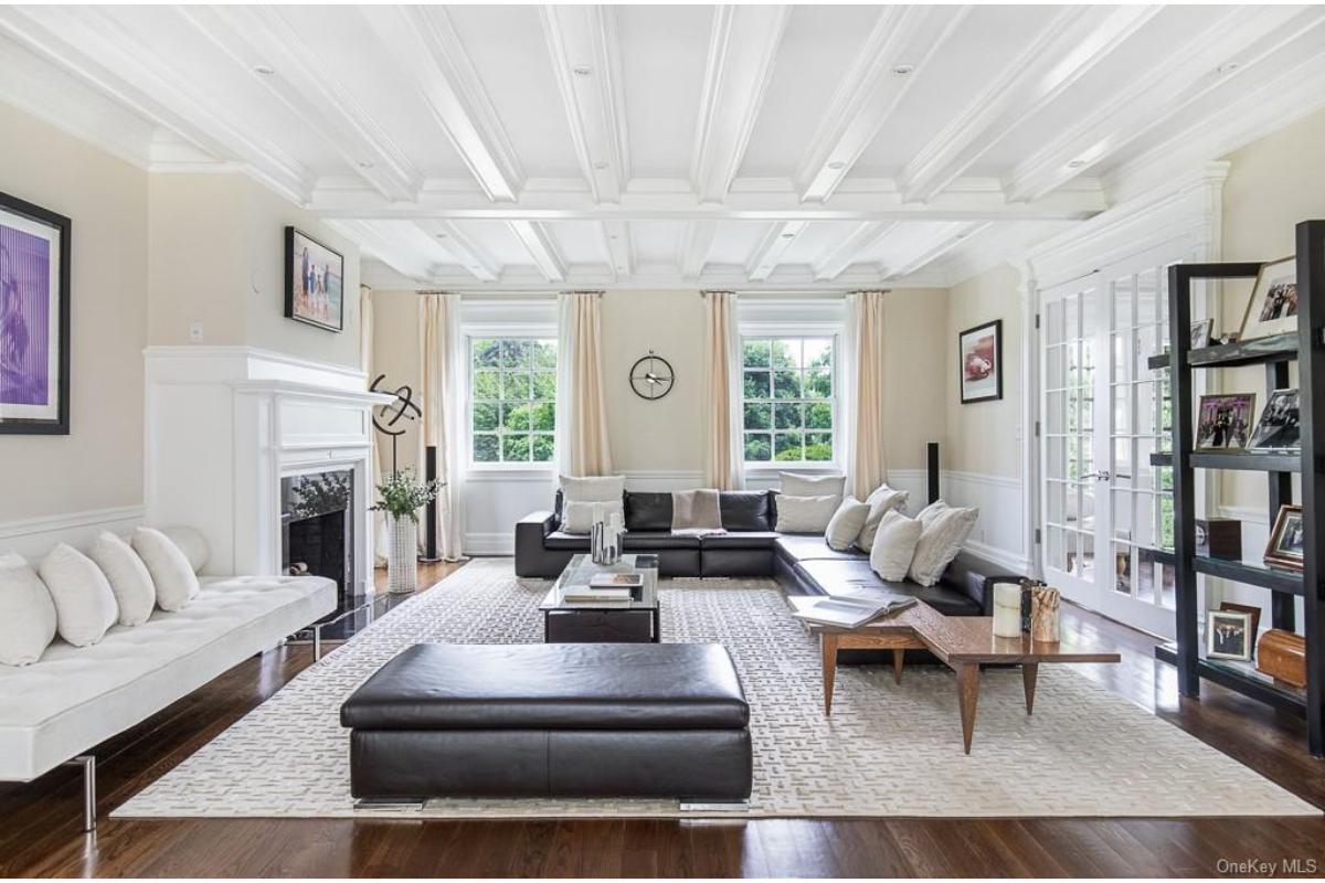 Elegant Living Room with Striking Coffered Ceiling and Spacious Layout