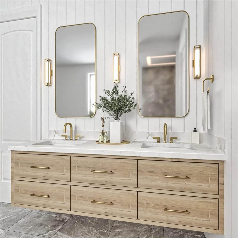 Elegant Bathroom Vanity with Gold Accents and Framed Mirrors