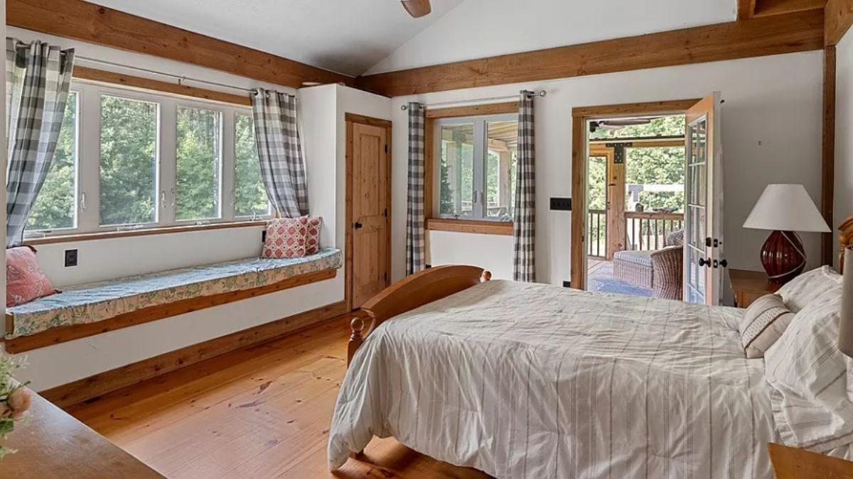 Cozy Bedroom with a Charming Window Seat Overlooking Nature