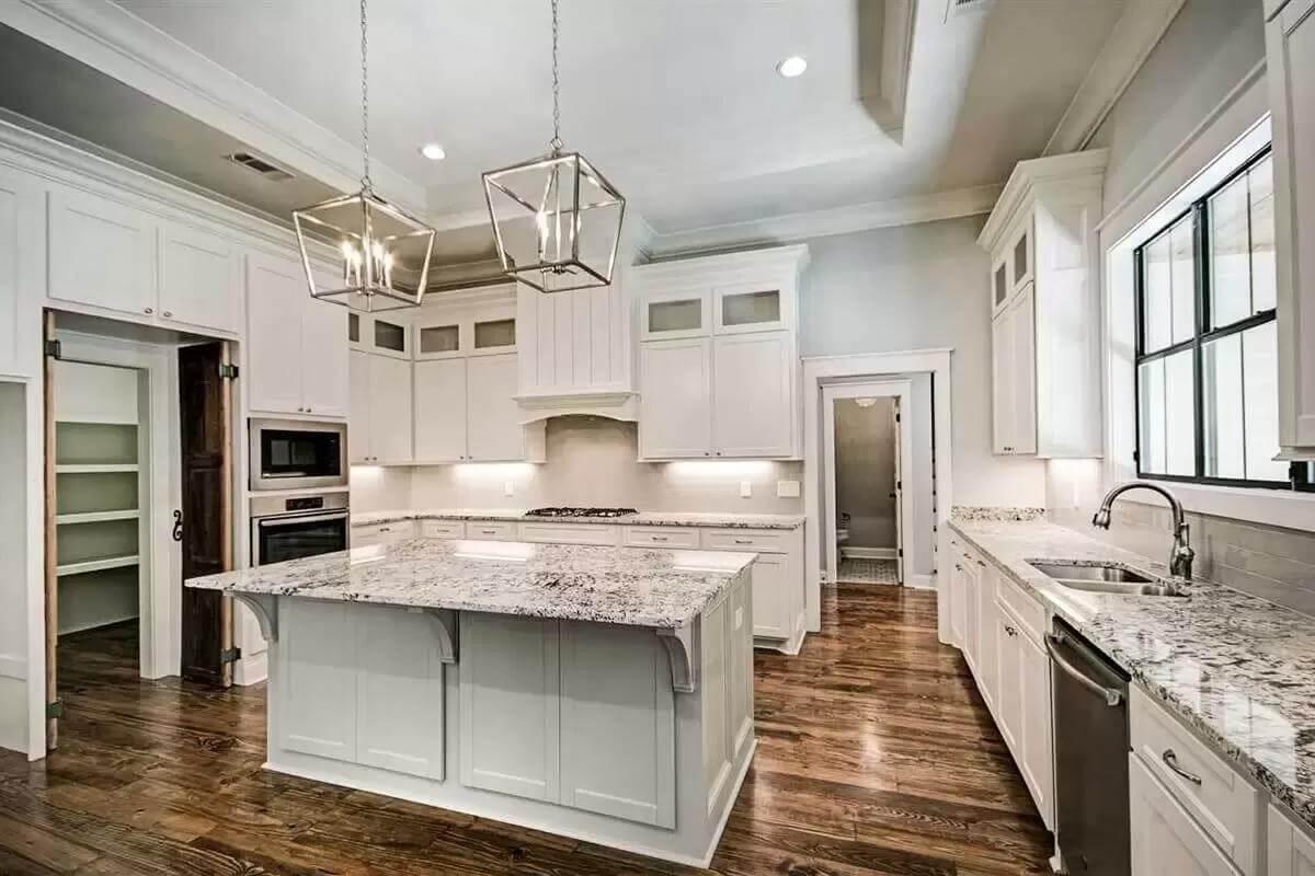 Wow, Look at the Granite Island and Lantern Pendant Lighting in This Kitchen