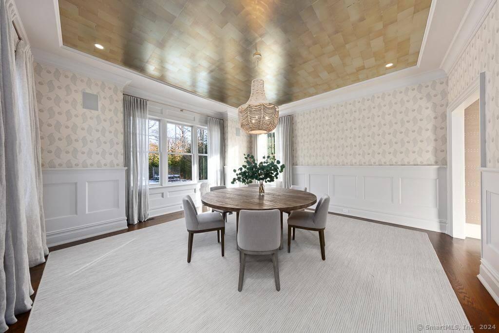 Striking Dining Room with Metallic Ceiling and Wainscoting