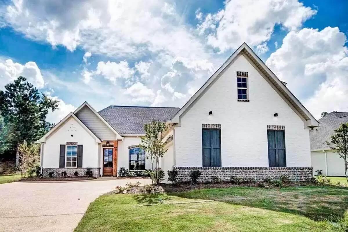 Brick Detailing and Rustic Charm Highlight This Craftsman Facade