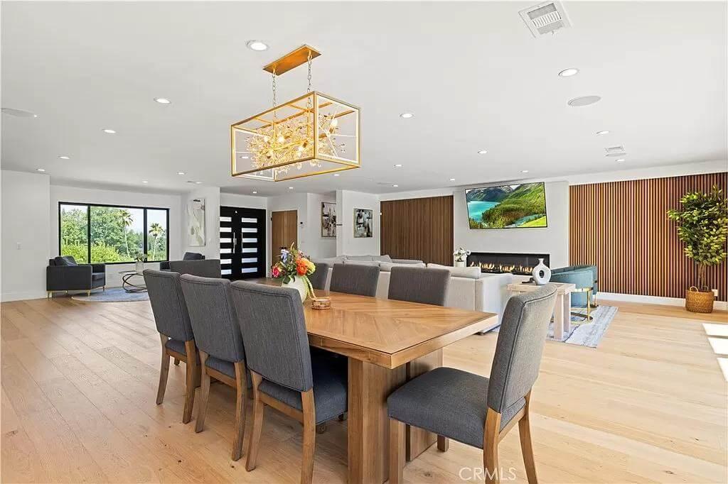 Dining Area with a Statement Chandelier and Open Flow