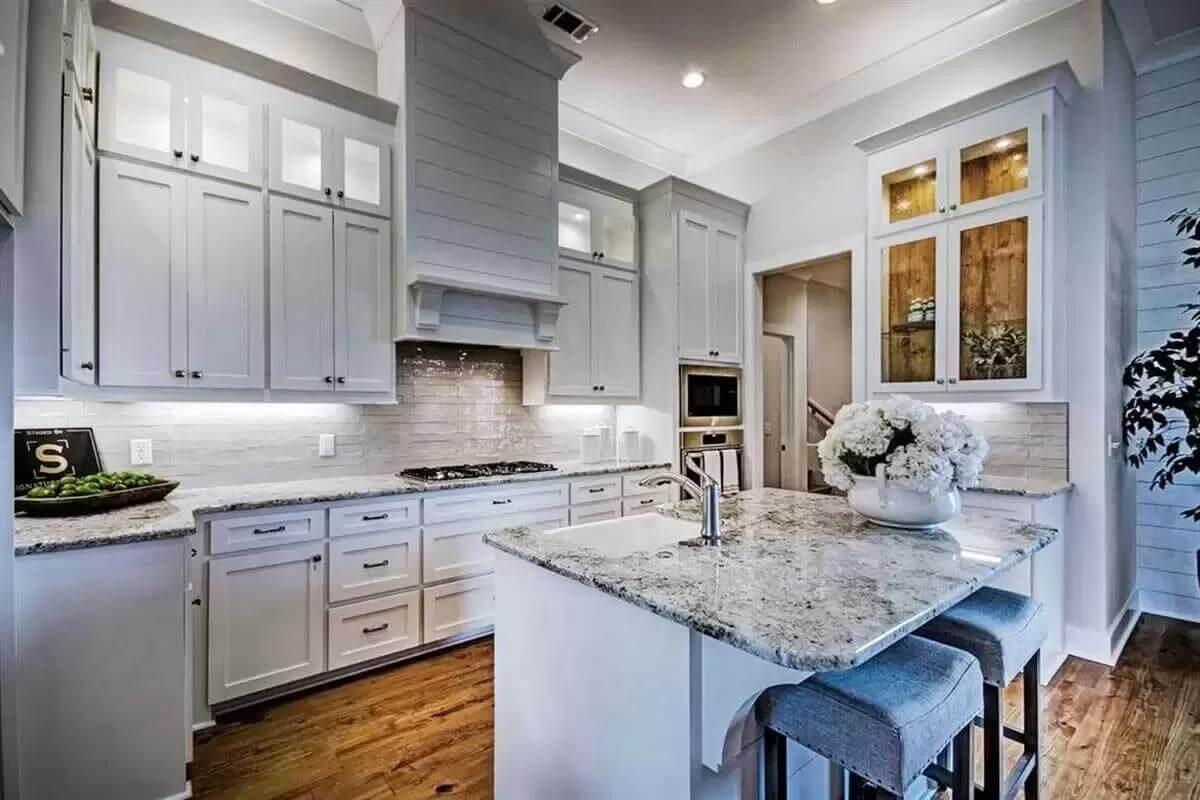 Check Out These Shaker Cabinets and Granite Countertops in the Kitchen
