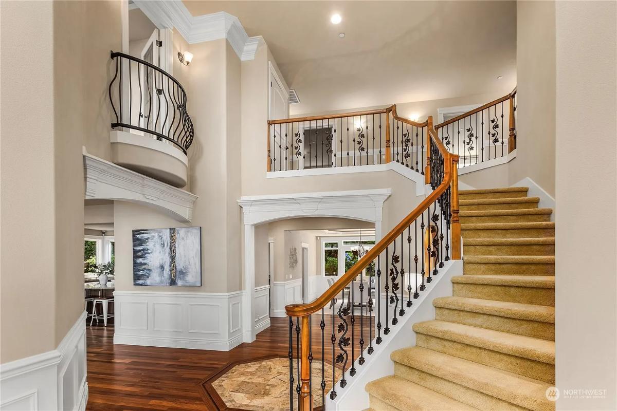 Explore the Dramatic Staircase with Iron Balustrades and Elegant Curves
