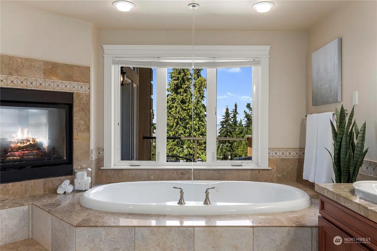 Luxurious Bathroom Escape with a Tub by the Fireplace