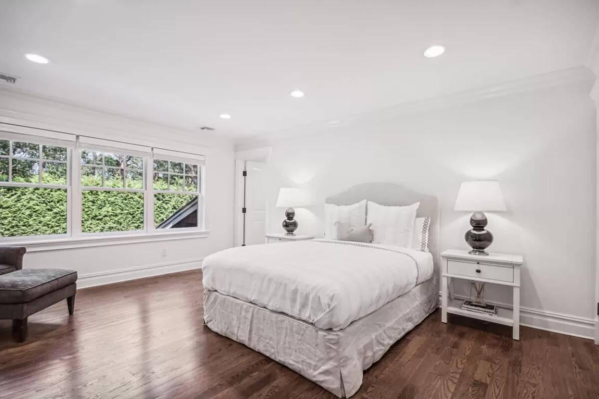 Minimalist Bedroom with Pristine White Palette and Garden Views