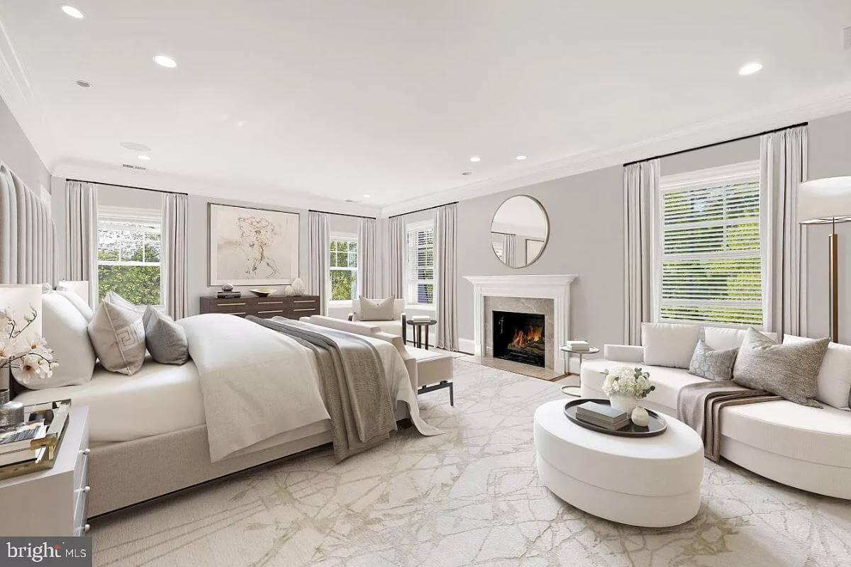 Relax in This Sophisticated Bedroom with Elegant Fireplace Feature