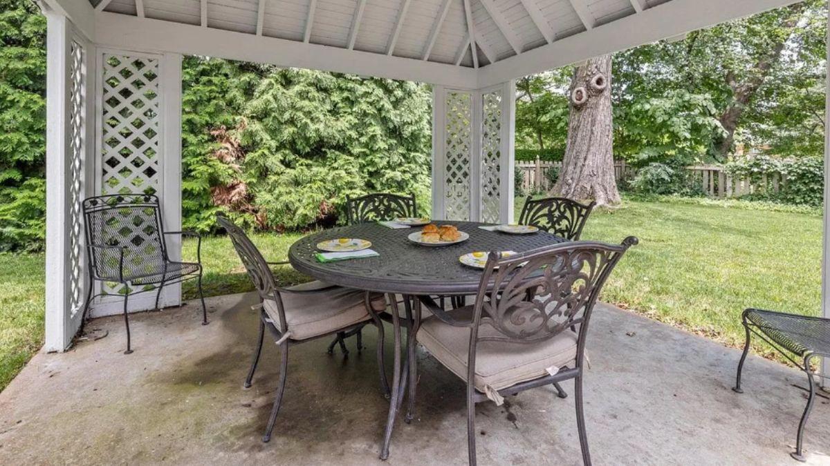 Charming Gazebo Dining with Elegant Iron Furniture