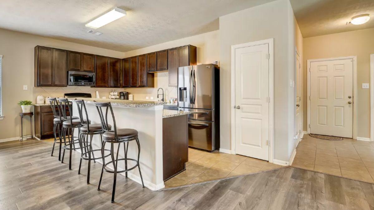 Functional Kitchen with Granite Countertops and Breakfast Bar