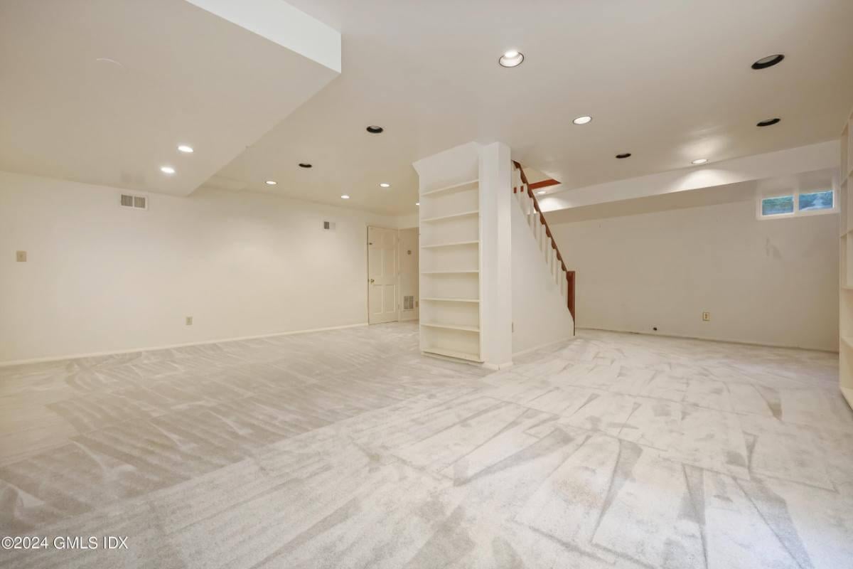 Unfinished Basement Primed for Customization, Check Out the Built-In Shelving