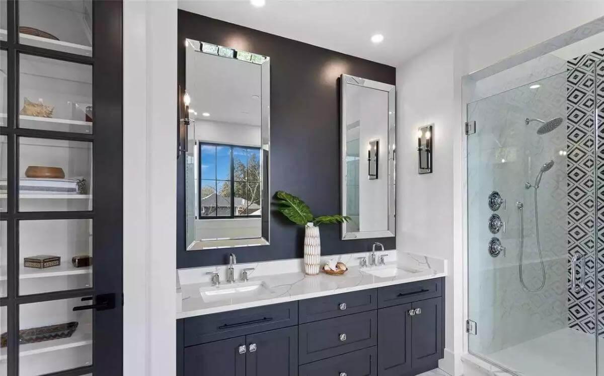 Sleek Bathroom with Double Vanity and Geometric Shower Wall
