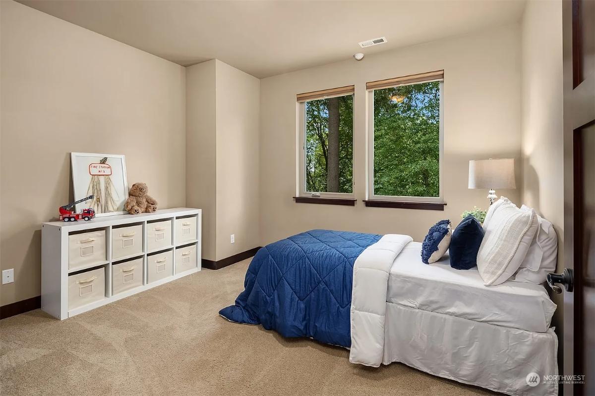Notice the Tranquil Forest Views Framed by the Bedroom Windows