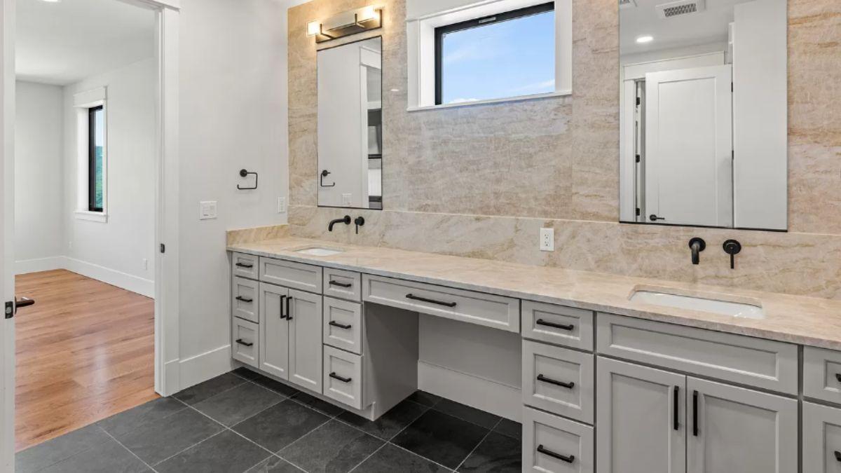 Discover the Double Vanity with Subtle Marble Backdrop