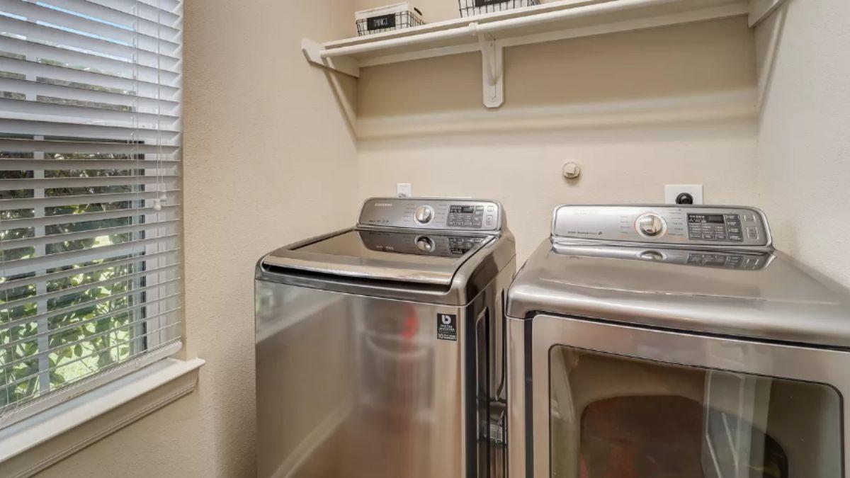 Simple Laundry Room with Modern Appliances and Practical Storage