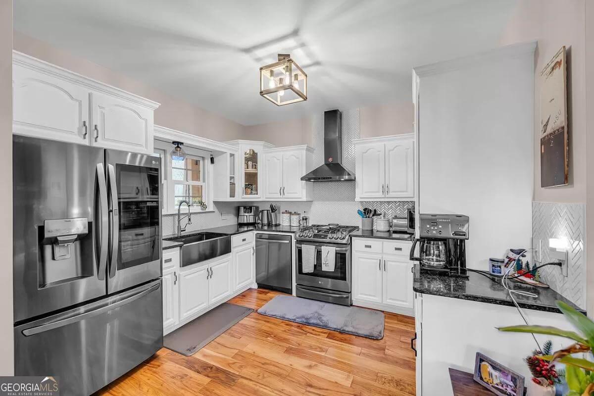 Farmhouse Kitchen with Sleek Stainless Appliances and a Farmhouse Sink